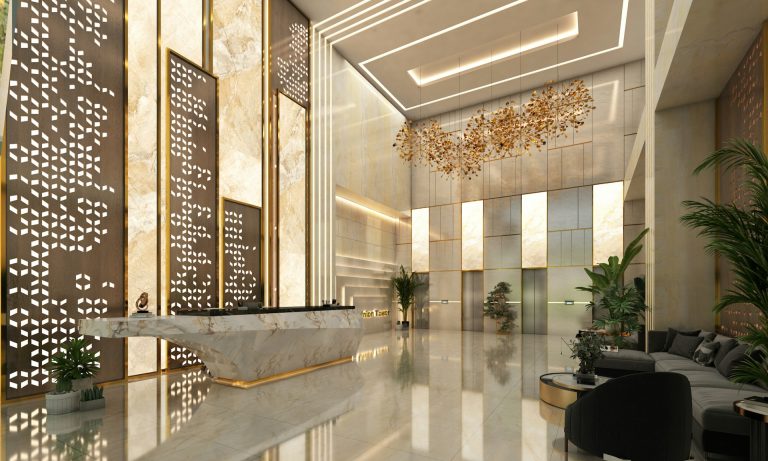 Vestíbulo corporativo con mostrador de recepción y control de acceso